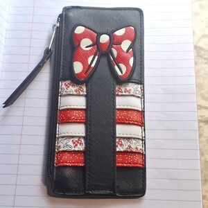 Minnie Mouse card holder/wallet. Has an ID compartment on back for convenience.